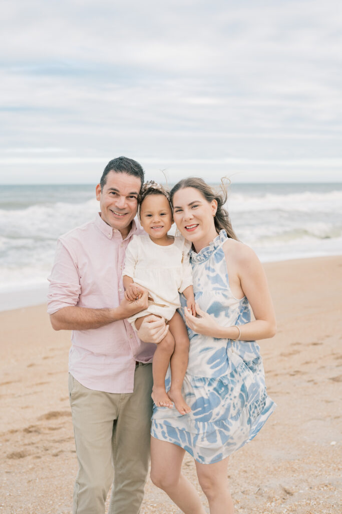 Family of three standing at sunset at Guana Reserve Middle Beach by Jacksonville Family photographer