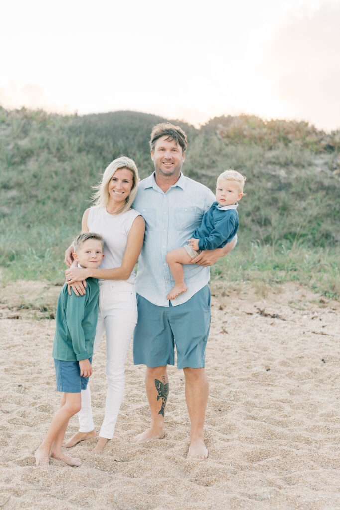 Hume Family standing at sunset at Guana Reserve Middle Beach